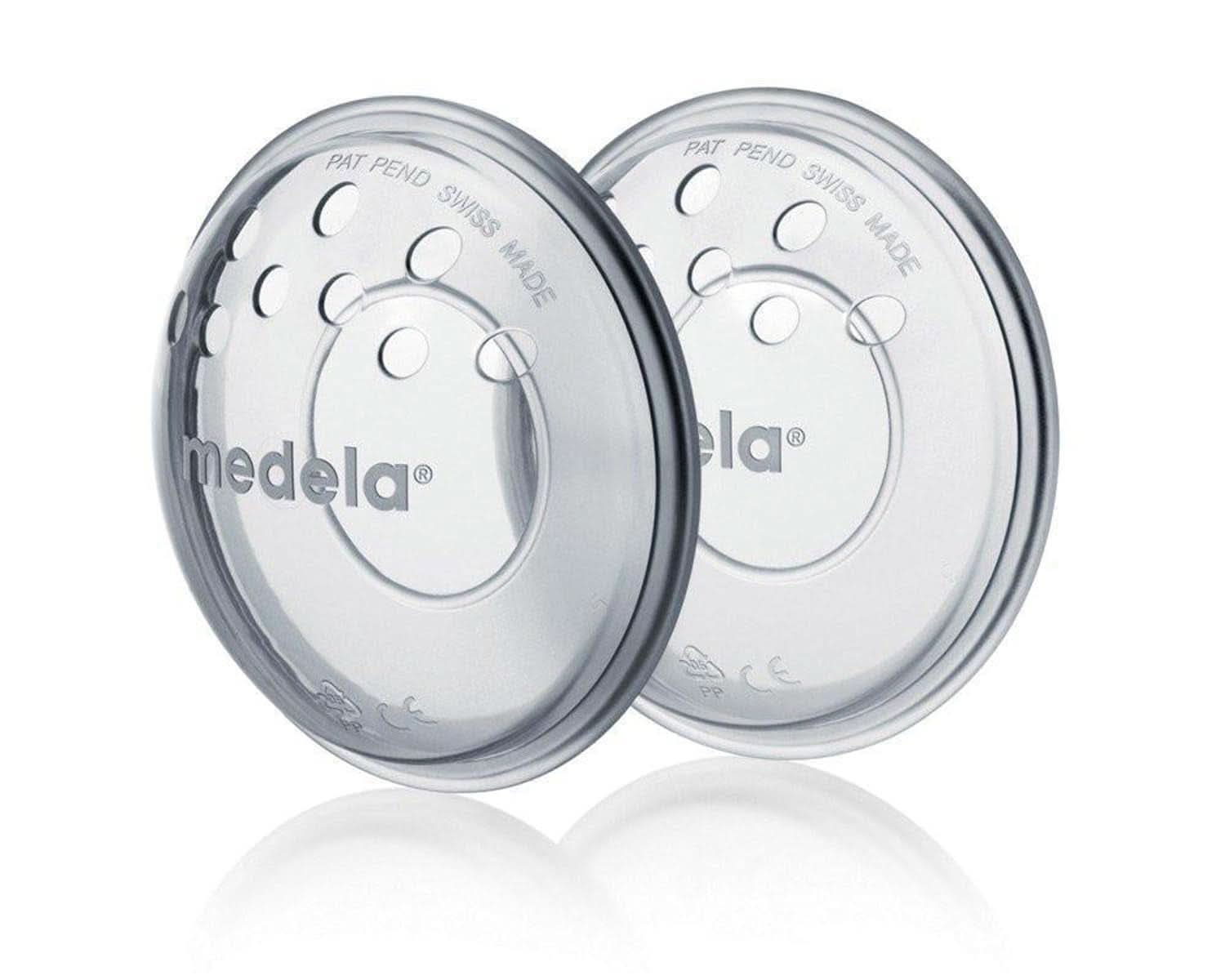 Medela bröstskal - BPA-fria, tillverkade av mjuk silikon, med ventilationshål som andas, inkluderar 2 skal Tillbehör Mat och amning Bebe Naty Shop