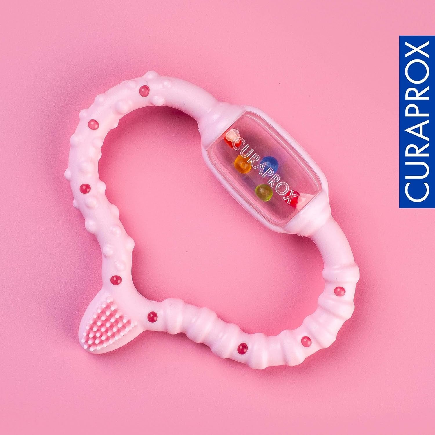 Curaprox babyring för tänder - För småbarn 0-24 månader / Lindrar tandvärk och främjar motoriska färdigheter | BPA-fri, rosa, med tränings-tandborste / Tillverkad i Schweiz
