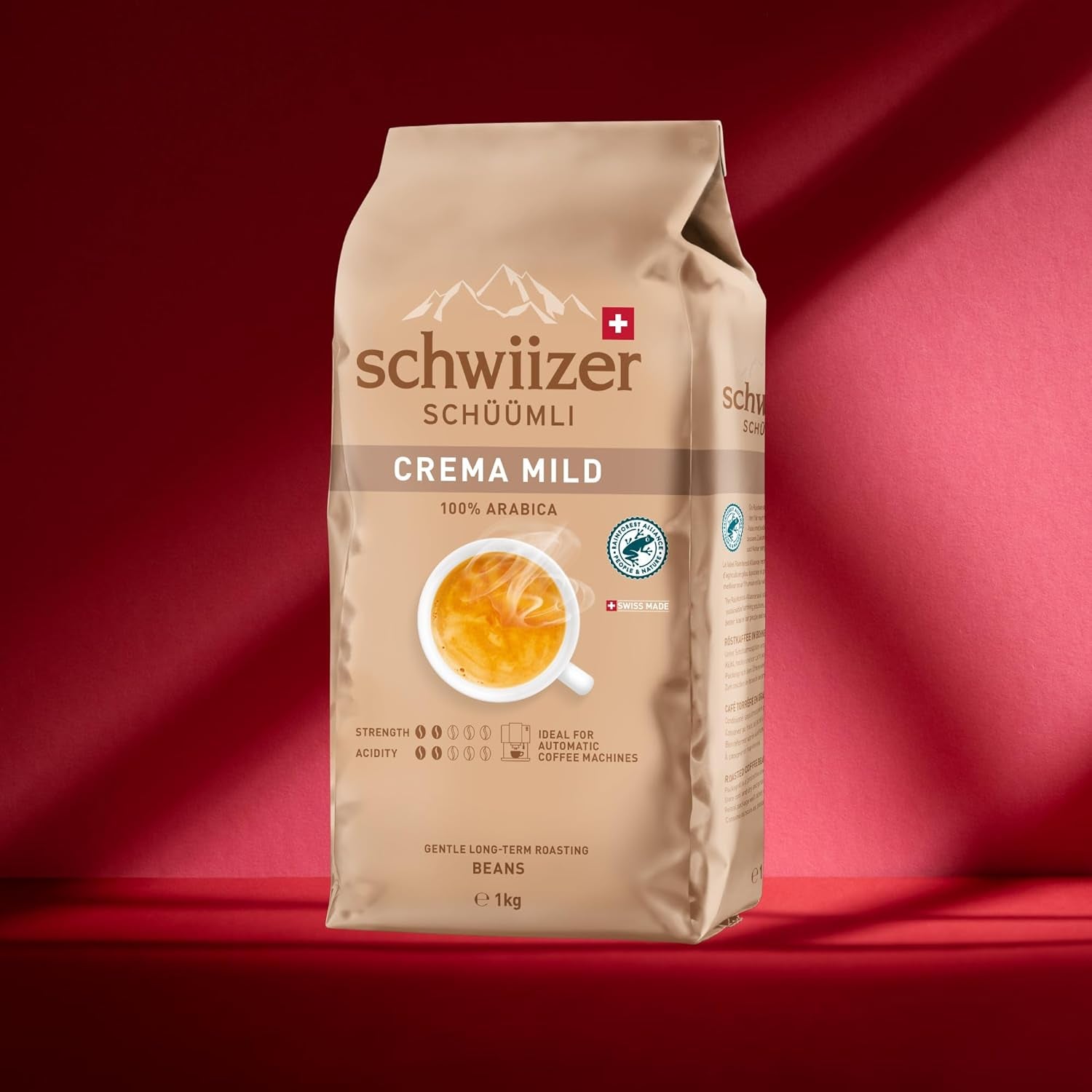 Schwiizer Schüümli Crema Mild, 100 % Arabica-kaffebönor fina, harmoniska och milda, idealisk för automatiska espressomaskiner, styrka 2/5, lättrostad, Rainforest Alliance, 1 kg
