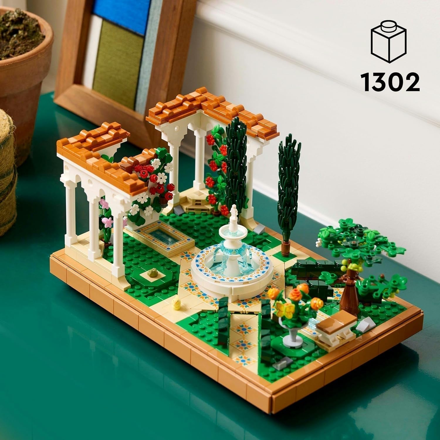LEGO Icons Fountain Garden - Byggsats i miniatyr för vuxna med löv, cypresser, träd, vinstockar, blommor - Kreativ födelsedagspresent, inflyttningspresent för kvinnor, män - 10359 Byggset Beuche den LEGO-Store