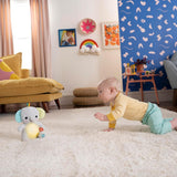 Bright Starts, Kram-a-bye babyelefantleksak med lampor, sånger, olika texturer och mer, flerfärgade Toys Bebe Naty Shop