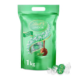 Lindt LINDOR Choklad med pistage | 1 kg återförslutningsbar påse | ca. 80 Mjölkchokladbollar med Smält-i-munnen pistagegräddefyllning | Bulkpaket, pralinpresent