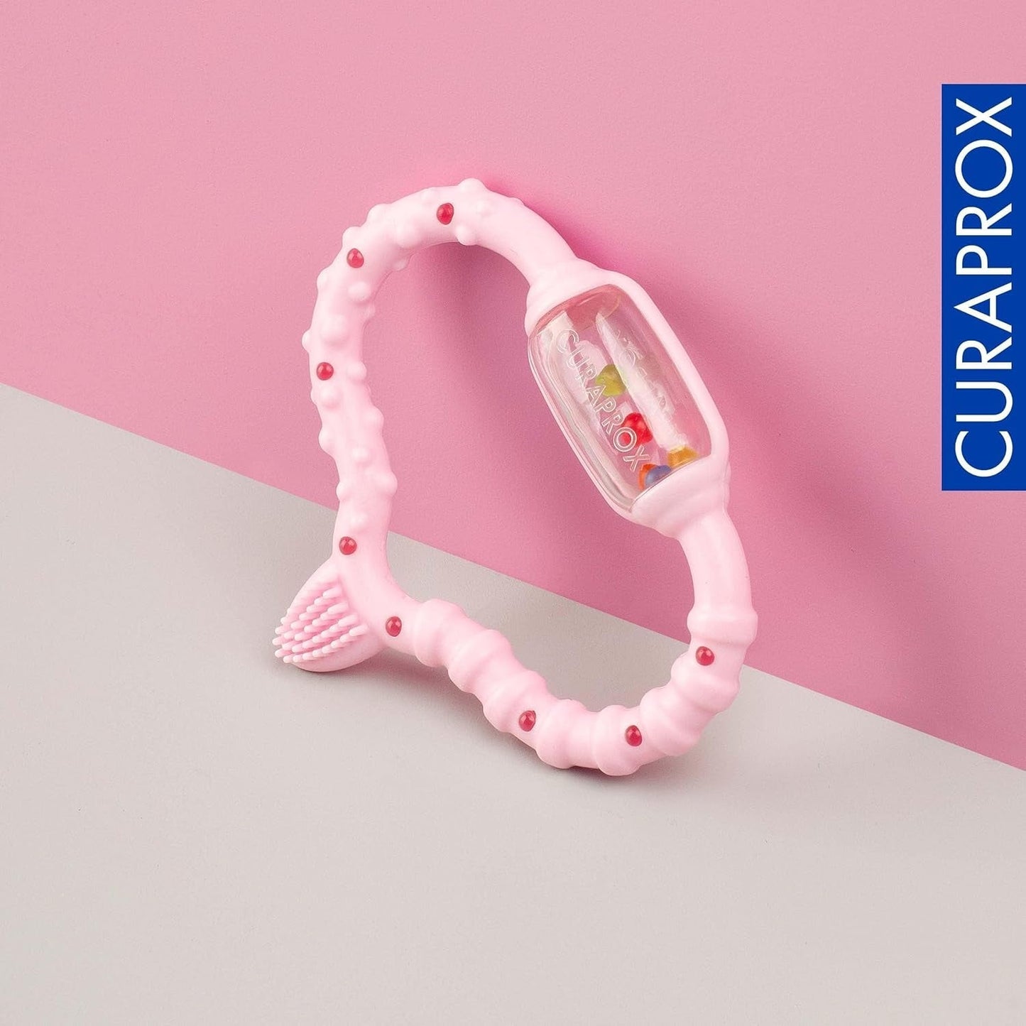Curaprox babyring för tänder - För småbarn 0-24 månader / Lindrar tandvärk och främjar motoriska färdigheter | BPA-fri, rosa, med tränings-tandborste / Tillverkad i Schweiz