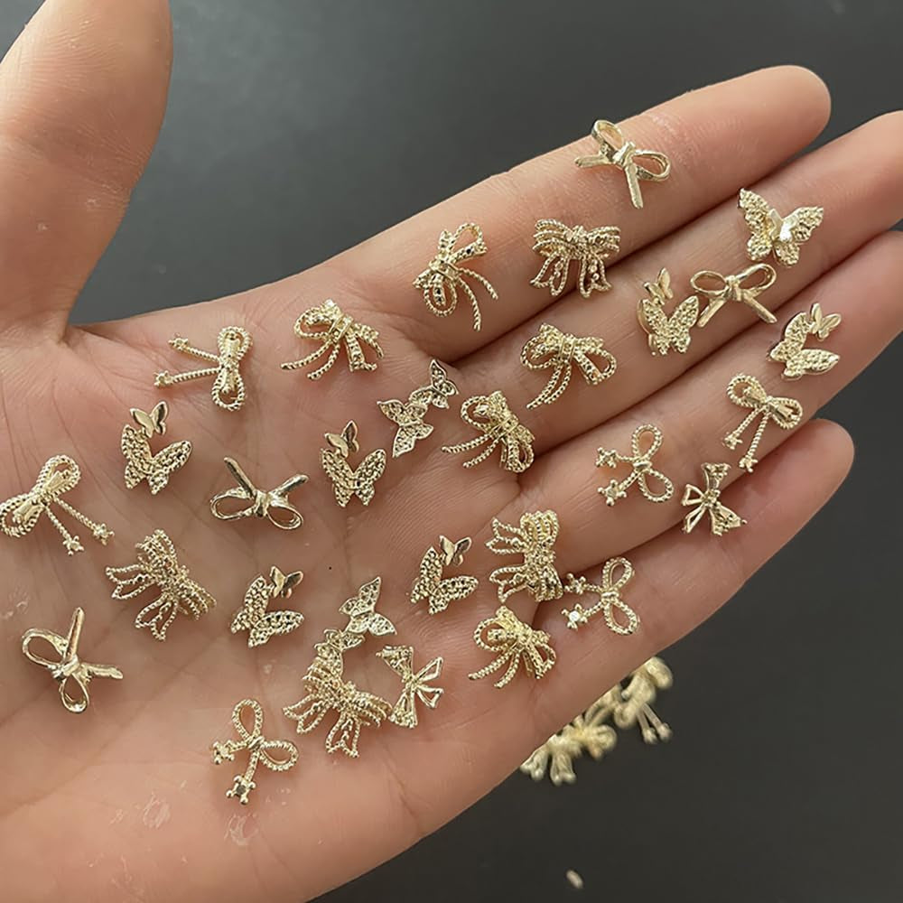 50Stück 3D Gold Bow Nail Charms Butterfly Nail Art Charms Legierung Bogen Nagel Charms Nägel Zubehör Schleife Nagelschmuck Metall Schleifen Schmetterling Nageldesign Nagelanhänger Nailart Strasssteine