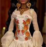 Barbie Signature Day of the Dead 2025 docka samlarfigur i krämfärgad klänning med volanger, ringblommor och rosetter, blomkrona i hår och Calavera ansiktsfärg, JBJ05